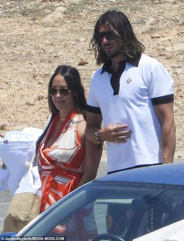 Her new husband Matthew, meanwhile, looked handsome in a crisp white polo shirt and slick sunglasses