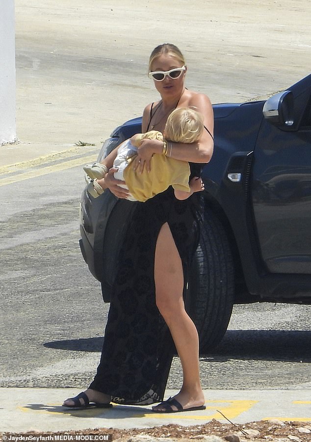 Meanwhile, former Nine journalist Airlie Walsh was stylish in black gown with a thigh-high split paired with chic white framed sunglasses