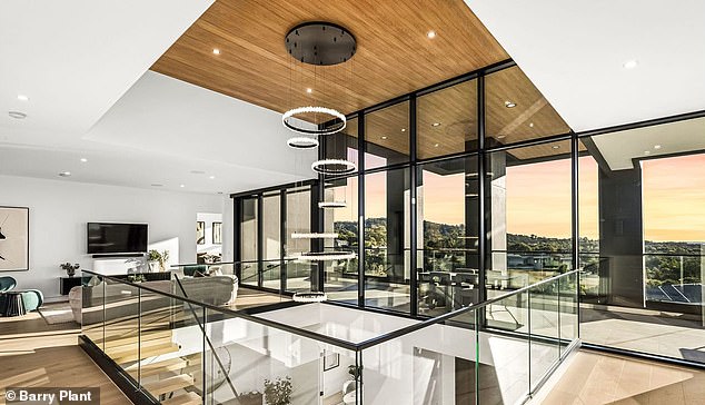Built on top of a hill in the sought-after Carrington Estate development, the sprawling two-storey home offers a commanding view of the surrounding bushland