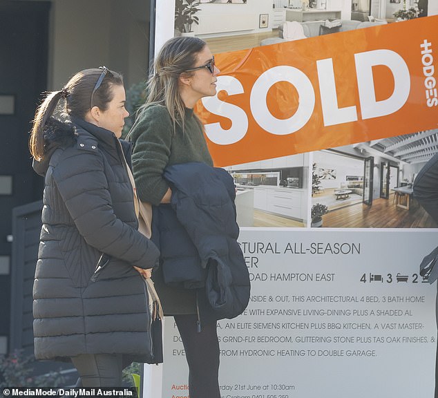 And they had plenty to be happy about as the 'SOLD' sticker outside their marital home proved they managed to off-load the $1.35million property
