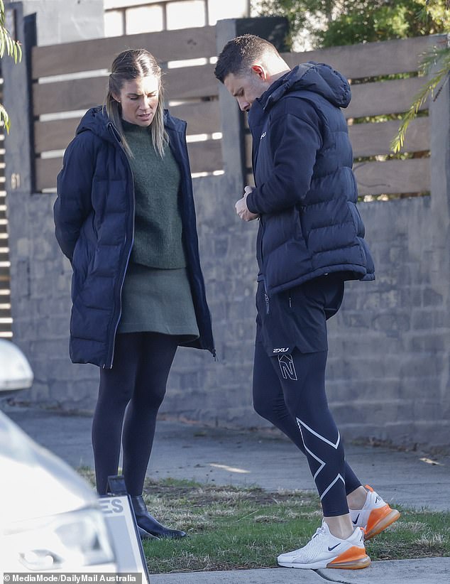 He slipped on a pair of tights beneath running shorts before adding a puffer vest over his jumper