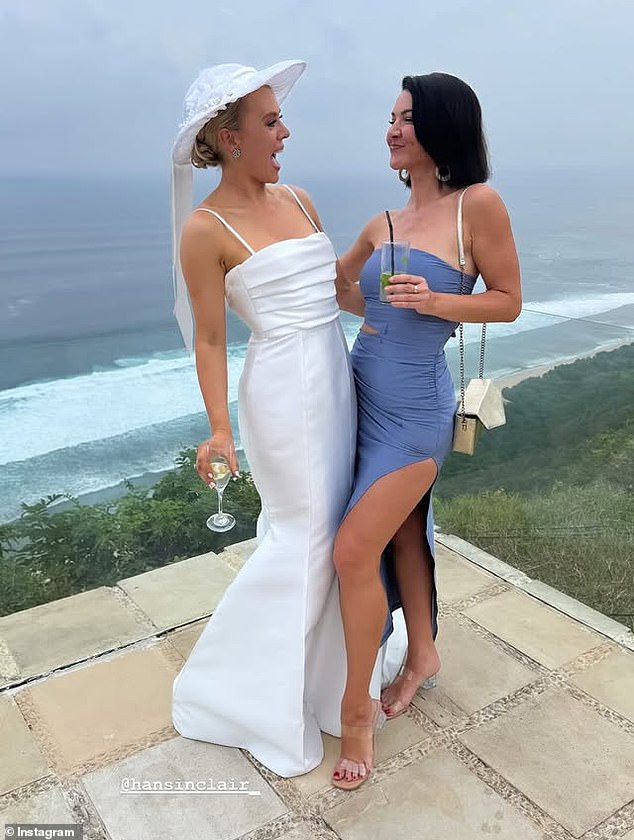 The journalist's bridesmaids all dressed in various baby blue dresses to fit the ocean theme