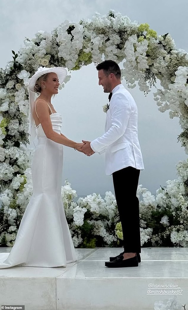 Hannah and Mitch shared their vows against a beautiful backdrop of the ocean with an archway of white flowers acting as the backdrop