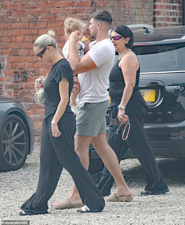 Molly-Mae opted for a black T-shirt and a pair of matching trousers while she also sported a pair of sunglasses