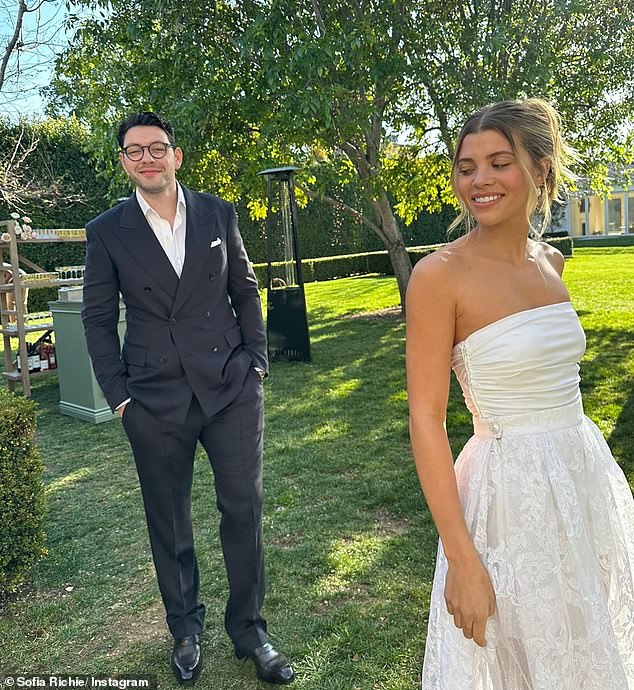 Sofia and Elliot are pictured on their wedding day in a photo she posted to Instagram last year in celebration of their first anniversary