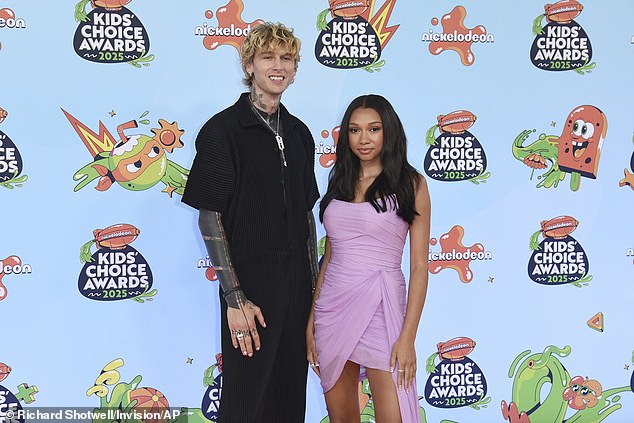 MGK - whose real name is Colson Baker - donned a black corduroy jumpsuit as well as a pair of black boots