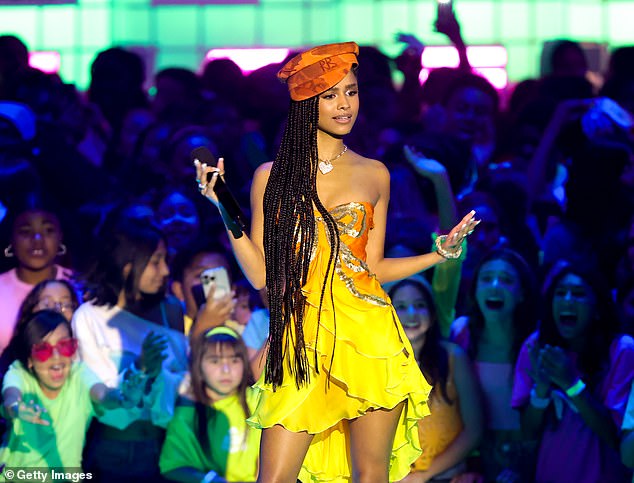 Another eye-catching outfit she opted for was a strapless dress with yellow and orange hues. A gold sequin bow embellishment was embroidered at the top