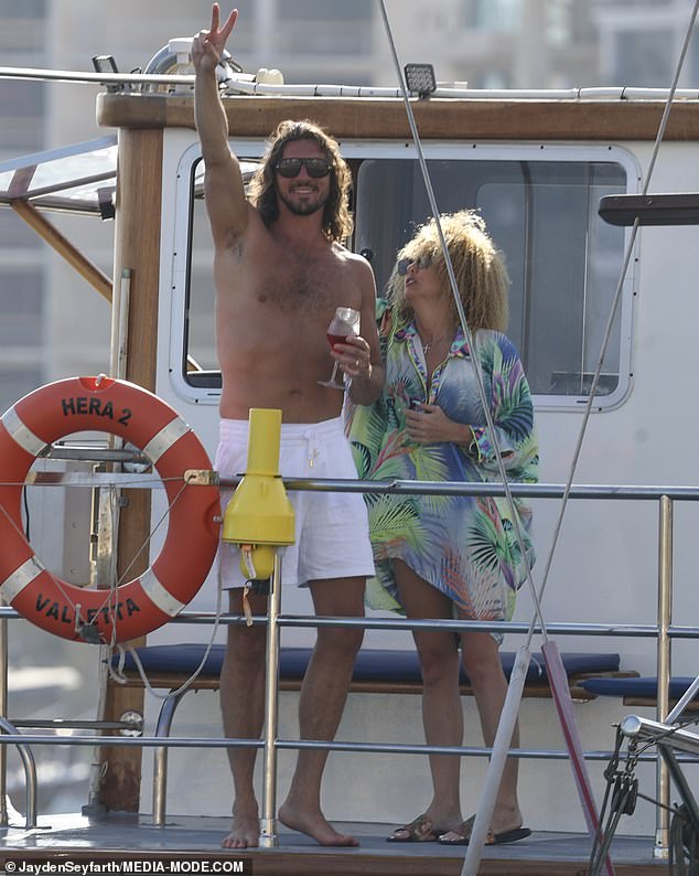 At one point Matthew was seen flashing a peace sign at photographers, while holding a glass of wine