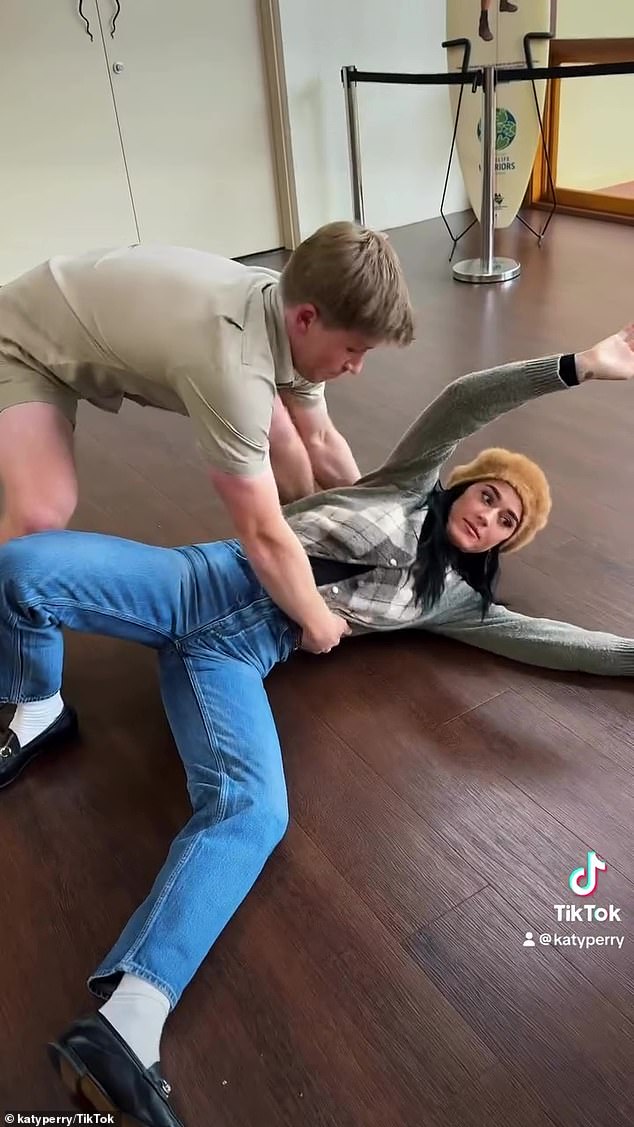 Katy then suggested a dip, but Robert dropped her, with Katy sprawled on the floor as she joked, 'Maybe stick to the animals'