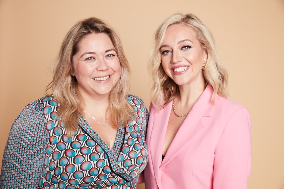 Portrait of two women smiling.