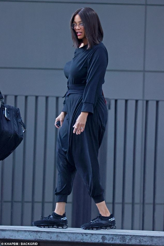 On her feet, the 51-year-old wore a comfy pair of matching black sneakers as she made her way around the Sydney waterfront