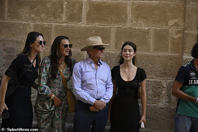 The Hollywood icon, 80, looked typically dapper in a panama hat and a blue shirt, which he wore with a pair of navy trousers