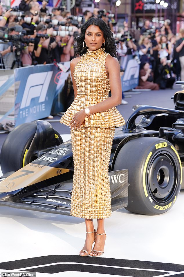 Despite the career blow, Simone oozed class in a gold outfit as she walked the glamorous red carpet in Leicester Square