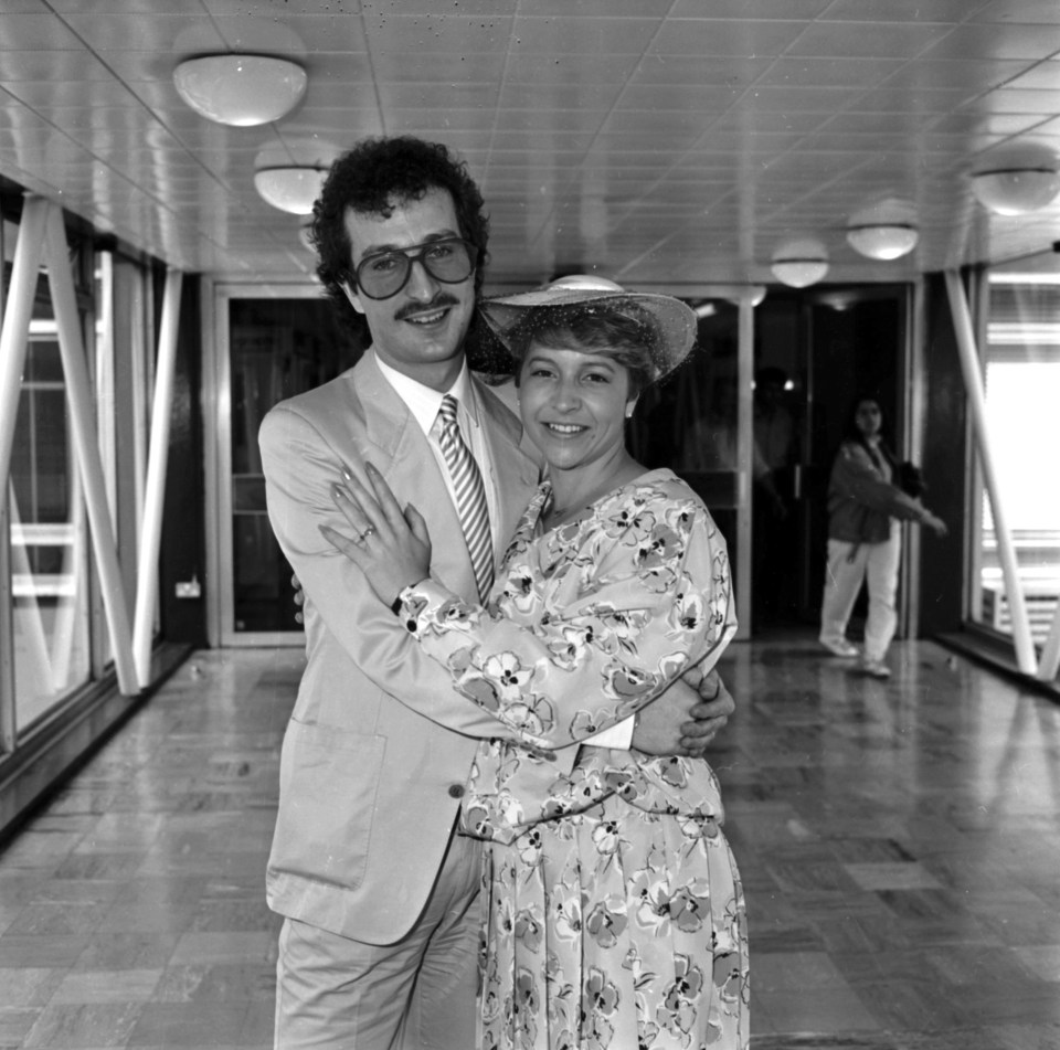 Black and white photo of DJ Steve Wright and his new wife at an airport.