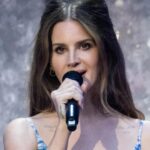 Emotional Lana Del Rey breaks down in tears before snogging husband as she opens debut stadium tour