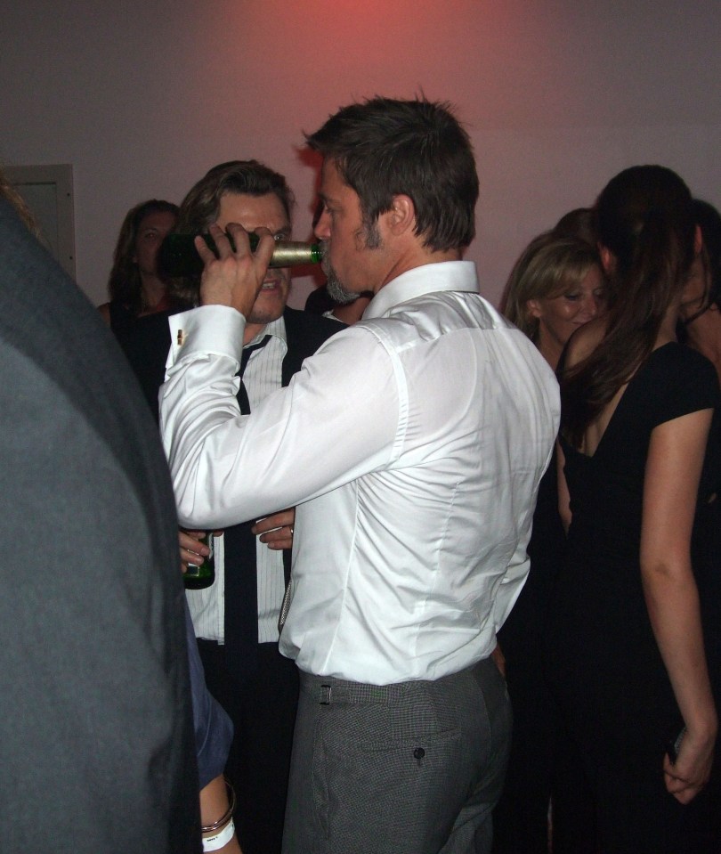 Brad Pitt drinking beer at an after-party.