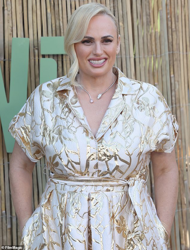 The Aussie actress cut an elegant figure in a modest white and gold frock with floral detailing