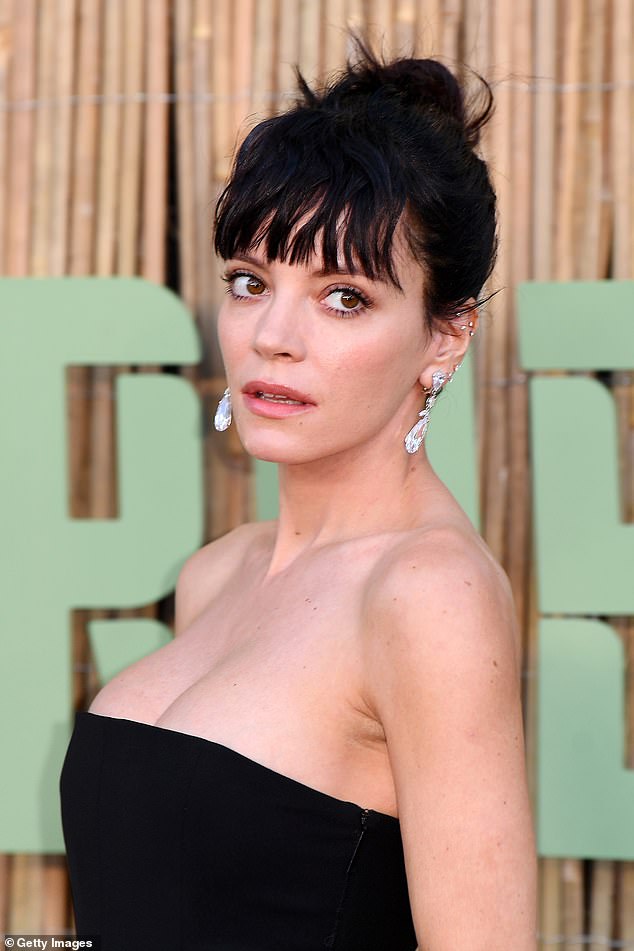 Accessorising with diamond dangly earrings, the singer showcased the results of her recent boob job which she underwent earlier this year following her split from husband David Harbour