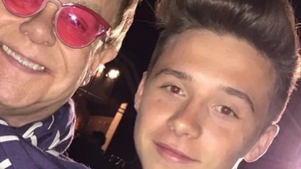 Brooklyn Beckham hits out again in family feud with tribute to wife Nicola's dad - as godfather Elton John backs him