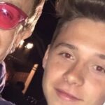 Brooklyn Beckham hits out again in family feud with tribute to wife Nicola's dad - as godfather Elton John backs him