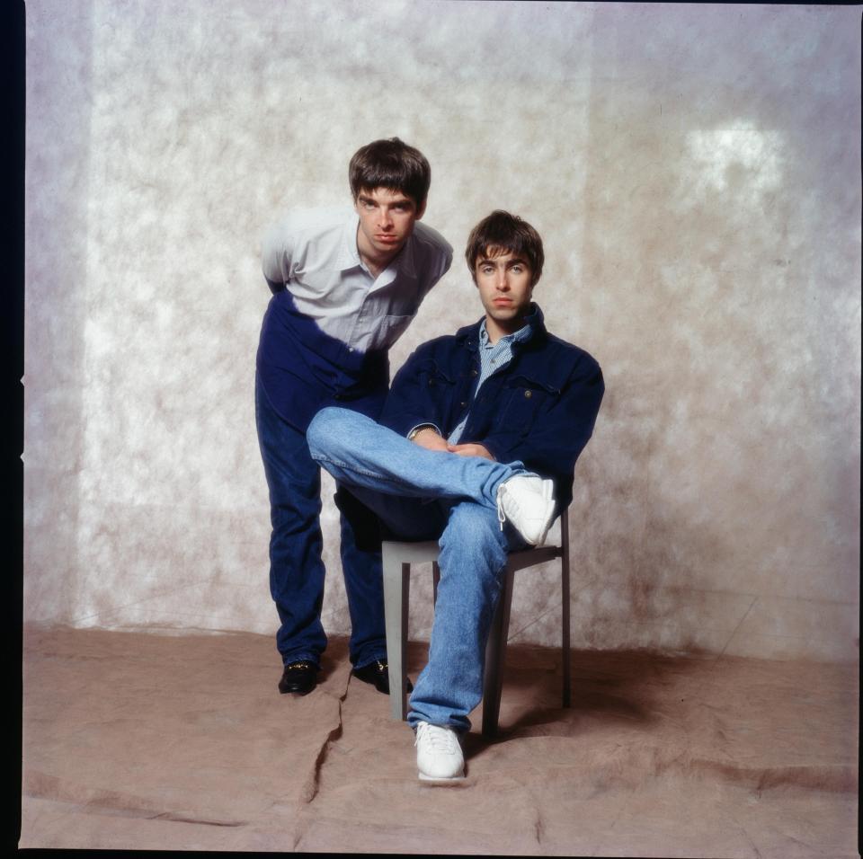 Photo of Noel and Liam Gallagher of Oasis during a photoshoot.