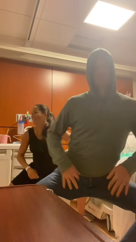 Meghan Markle and Prince Harry dancing in a hospital room.