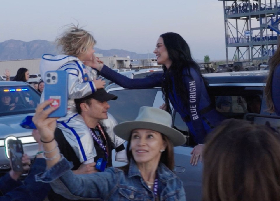 Katy Perry says goodbye to her daughter and husband before a space launch.