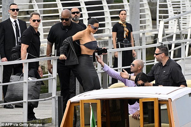 An assistant was seen holding onto one of the star's bags as she made her way to her hotel