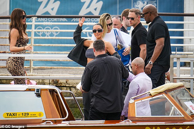 Kim looked in good spirits as she waved at onlookers from her river taxi