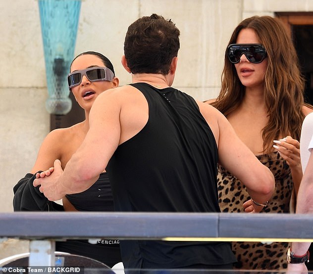 Orlando, 48, wasted no time reaching in for several air kisses with Kim, 44, as the pair joined Khloe Kardashian and friends for a catch up before the ceremony