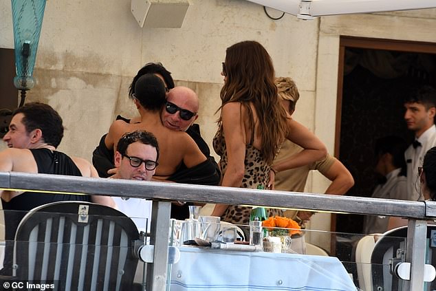 Kim was later seen greeting another friend as the group mingled with each other