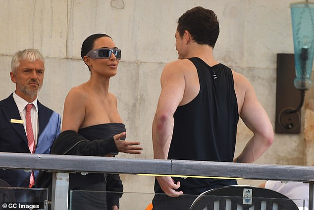 They looked in good spirits as they chatted away ahead of attending the big wedding
