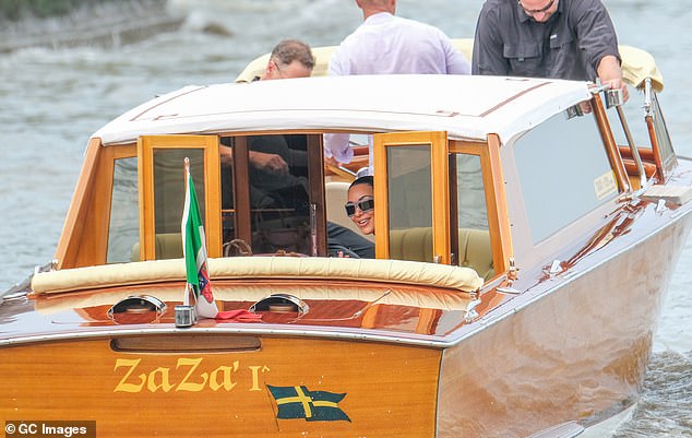 Kim looked in great spirits as she set off along the canals of the Italian city