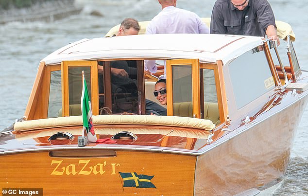 Kim looked in great spirits as she set off along the canals of the Italian city