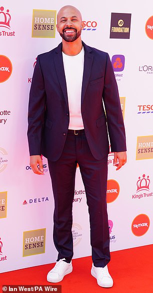 The JLS singer cut a cool figure in a white T-shirt and black blazer as he cosied up to his glamorous wife