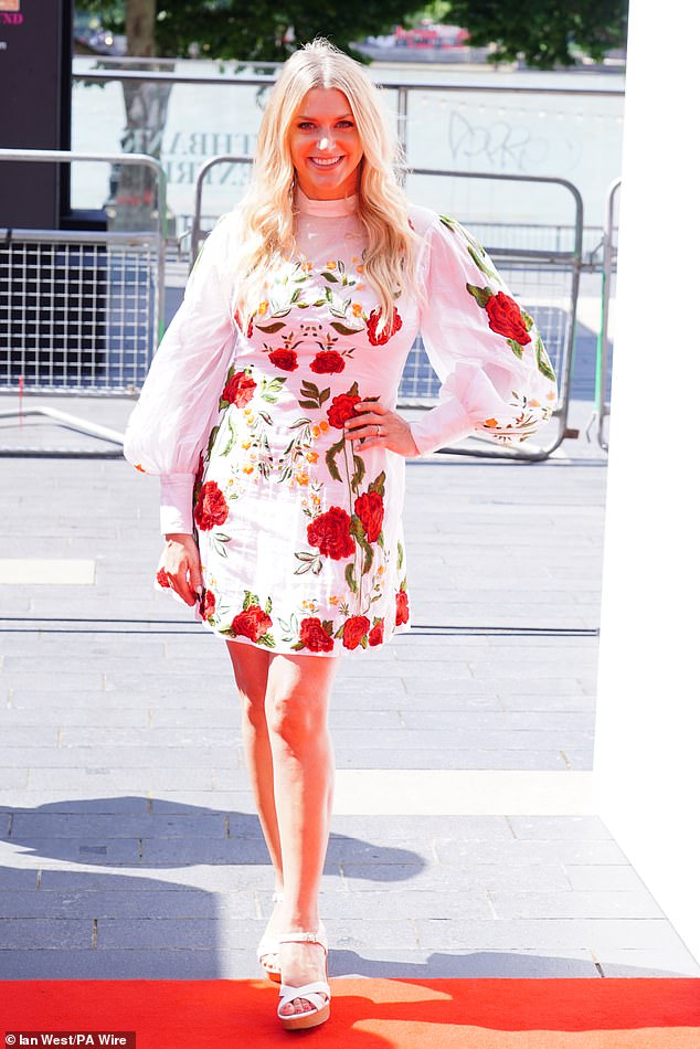 Anna Williamson put on a leggy display in a white floral minidress and stylish sandals
