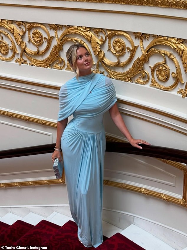 Guests were asked not to photograph on the Grand Staircase, which was built for Queen Victoria, and breaking the rule, Tasha leaned on the banister looking up at the historic artwork