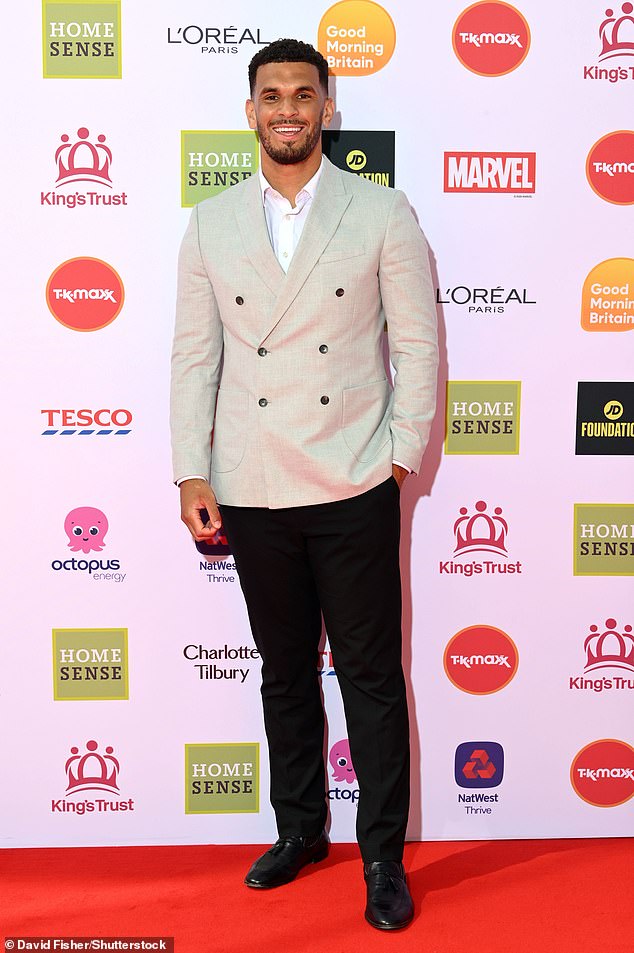 Love Island winner Kai Fagan beamed in a beige linen double breast blazer