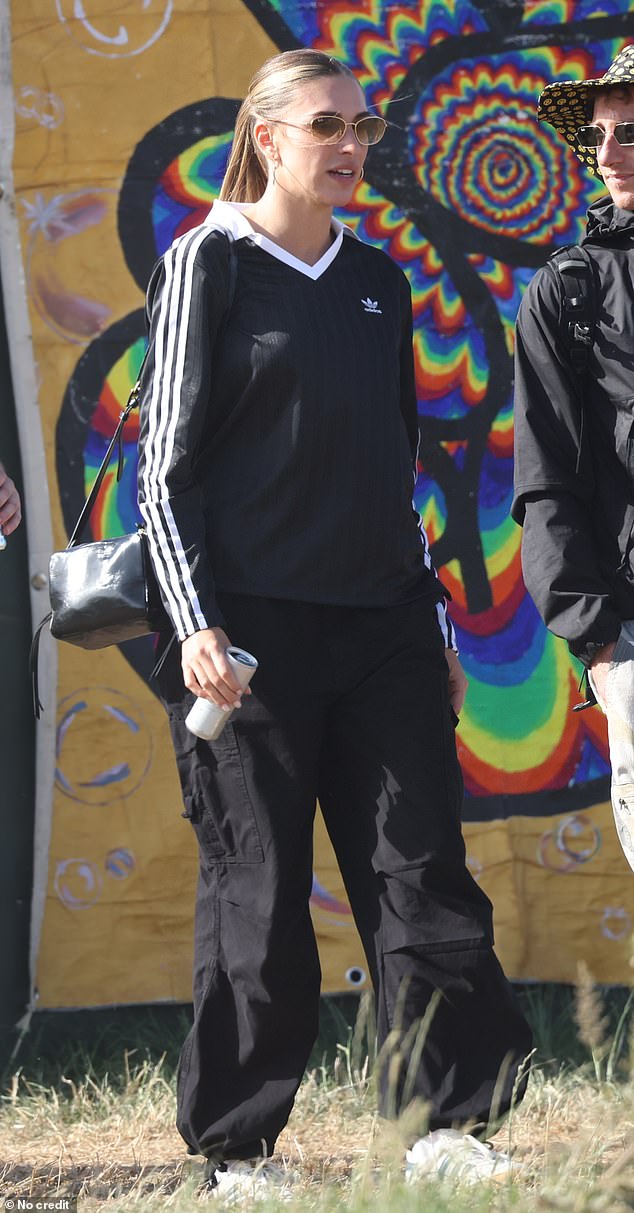 Meanwhile Zara, who also sported sunglasses, wore an black adidas top with dark trousers and tied back her long blonde locks into a ponytail