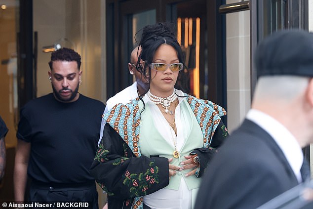 The singer, 37, who is expecting her third child with the rapper, 36, donned a white shirt beneath a mint green waistcoat