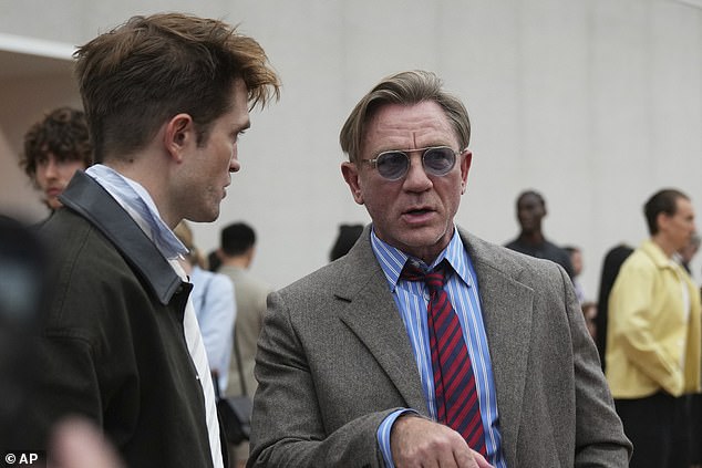 Daniel Craig rocked a smart-casual look, donning a smart tweed blazer, blue shirt and red tie teamed with dark jeans and white trainers