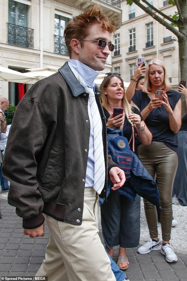 Elsewhere, Robert Pattinson opted for the same popped collar look as Asap as he wore his cream tie over his collar