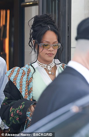 Rihanna showed off her bling in a Marlo Laz Artemis Cameo Necklace, Briony Raymond Sloan Ear Cuff, Pave Diamond Sloan Ear Cuff, and Sloan Stud Earrings
