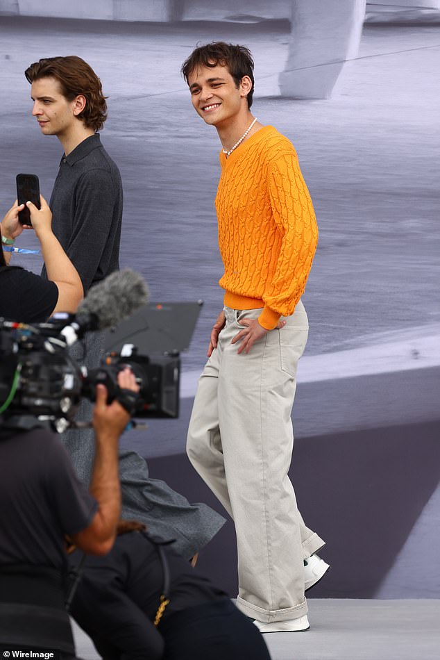 Manfredi Marini caught the eye in a bright orange knitted jumper