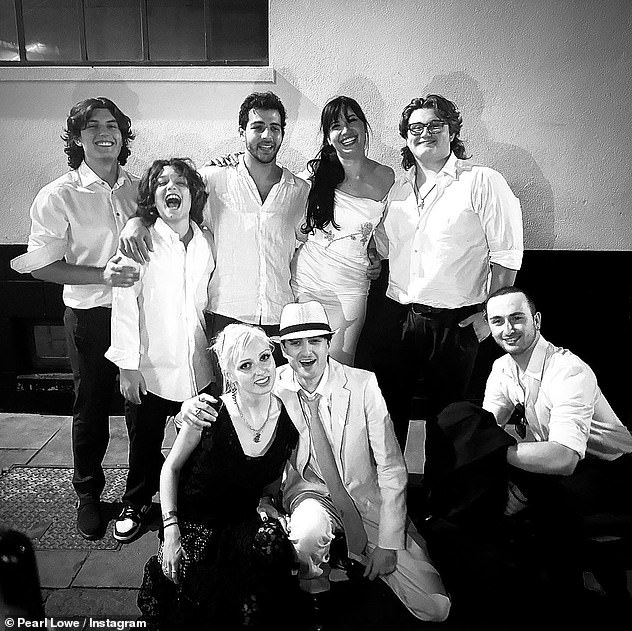 Daisy pictured with new husband Jordan (centre) as well as family, including half-sibling Zuma (top right) and (bottom row L-R Betty Lowe, Alfie and Frank Goff)