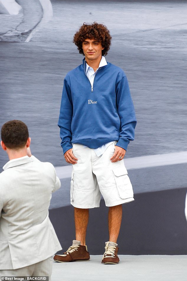 Striking red carpet poses like a seasoned pro, his signature mop of curly hair added the perfect dose of youthful charm
