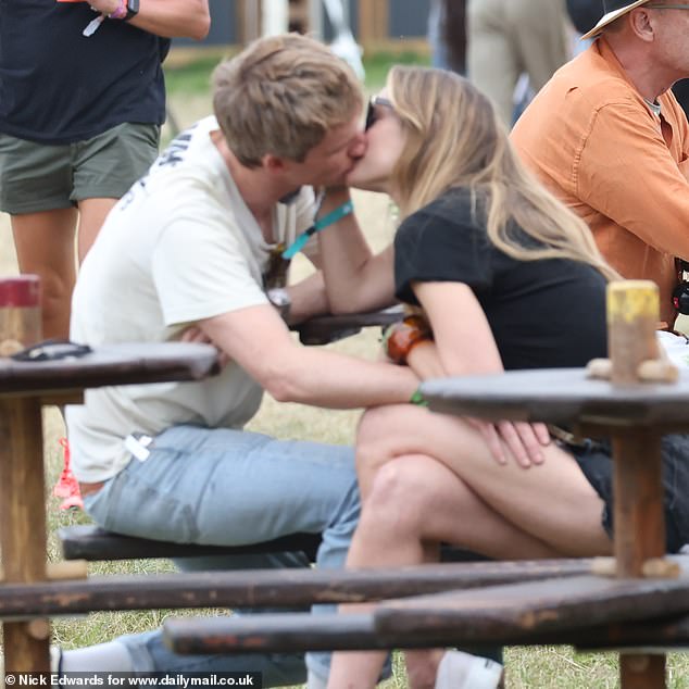 Dressed down in a beige Nike t-shirt, the Theory of Everything actor, 43, was sipping on a drink in the VIP area where he was mixing with the likes of Sophie Turner and Harry Styles