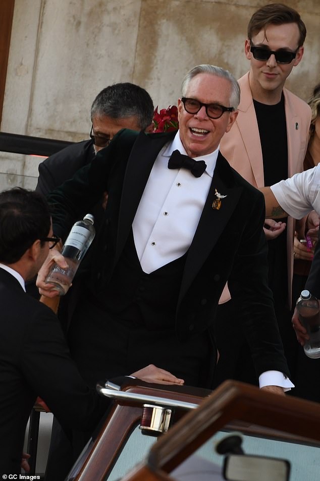 The lip reader said that Hilfiger looked to his side and asked: 'Why do we need to stand here?'