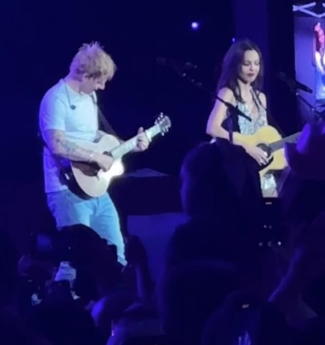 Together the pair played their guitars while belting out the iconic lyrics while the 65,000 strong audience cheered in delight