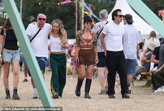 She got into the festival spirit as she and Marco enjoyed the day of the action